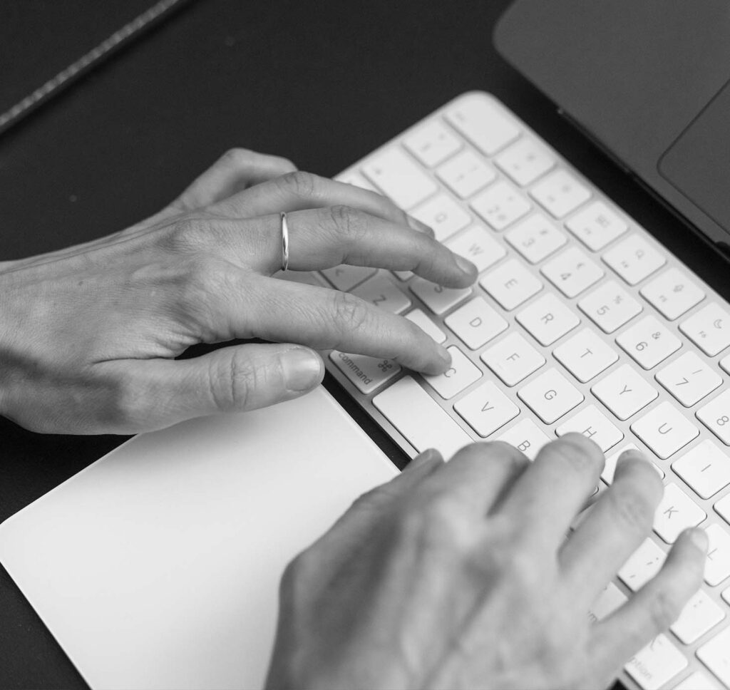 Female fingers typing on keyboard